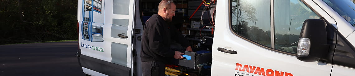 RSC technician prepping for a customer scheduled maintenance visit next to open service van.
