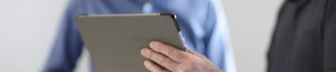 Using a digital tablet to read the latest RSC news and press releases.
