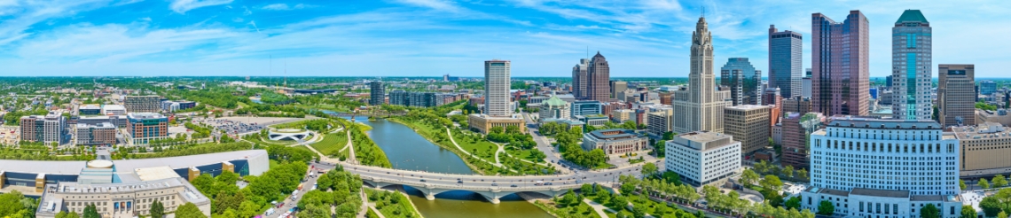 Aerial view of downtown Columbus, OH with government building, skyscraper buildings, Scioto River and bridges.