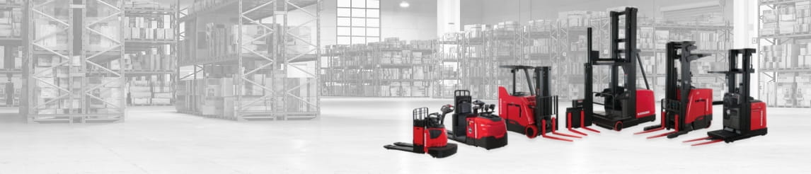 Six of red Raymond lift trucks lined up with a warehouse background.
