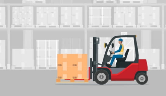 Red forklift and operator driving in gray warehouse with pallet of boxes.