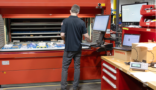 RSC parts associate pulling material handling parts from ASRS to fulfill customer orders.
