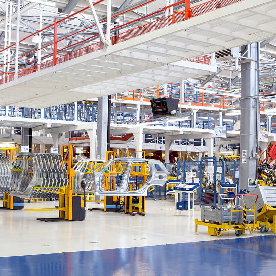 The side car frames in an automotive assembly line in modern warehouse.