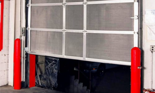 Metal mesh bug door in warehouse