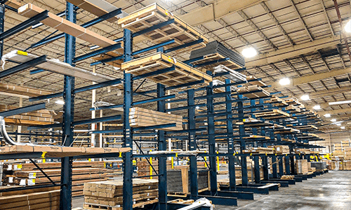 Cantilever racking storing lumber in warehouse.