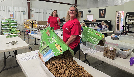 RSC volunteering employees bag pet food at SPCA's Chow Now Pantry.