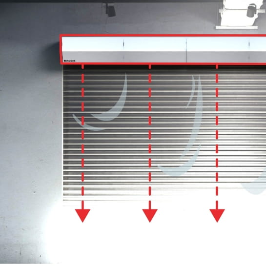 Air curtain with graphics to illustrate air flow and how it can be blocked on a dock door.