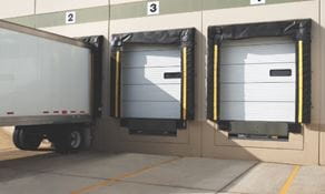 Warehouse loading dock area with compression seals and trailer