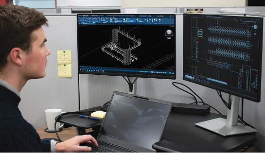 RSC engineer designing racking and automation system in CAD.