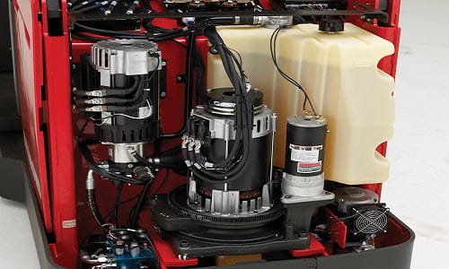 Forklift with cover removed revealing the engine.