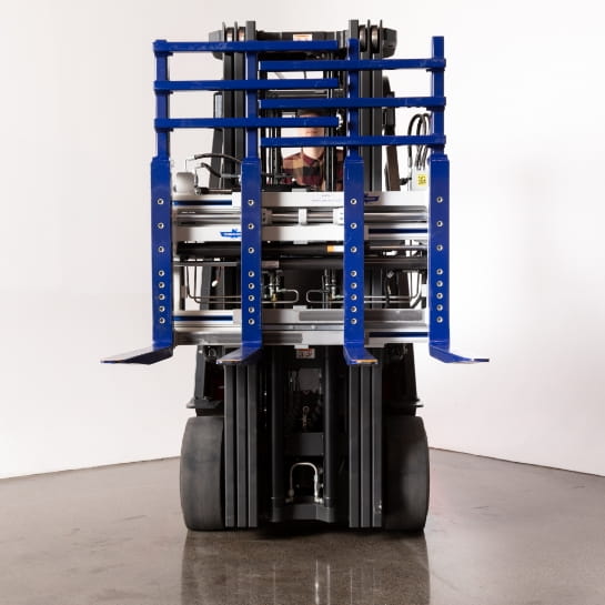 Counterbalanced forklift with a 4-prong fork attachment for wider pallets.