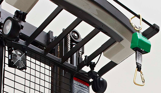 Close up of a forklift overhead with a fall protection tether attached.