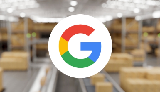 Google G icon overlaid on a blurred warehouse with boxes, conveyor and racking.