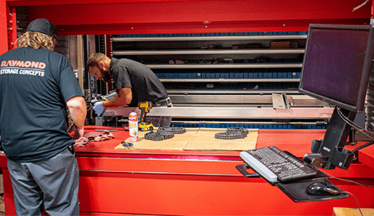 Two RSCI technicians servicing a Kardex Remstar AS/RS.