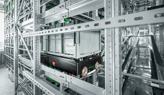 Close up of a Movu shuttle cart with box on top, inside of a pallet shuttle racking system.