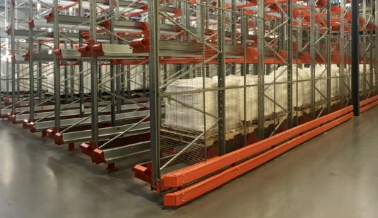 Multiple pallets loaded in an semi-automated pallet racking system by Radioshuttle.