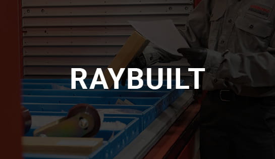 Parts team member pulling a RayBuilt refurbished parts order together from an AS/RS tray.