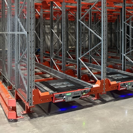 Radioshuttle handler sitting in a racking system.