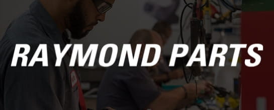 Raymond Parts. Technician with safety glasses holding wires.