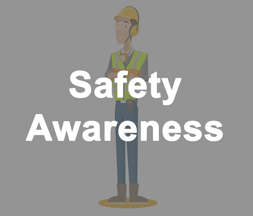 Safety Awareness. Construction man standing while wearing hardhat and safety vest.
