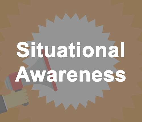 Situational Awareness. Hand holding a bullhorn.
