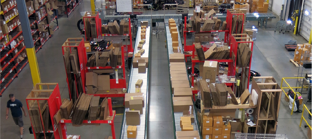 Parallel running conveyors for a shipping and packing warehouse area at Specialized Bicycle Components.