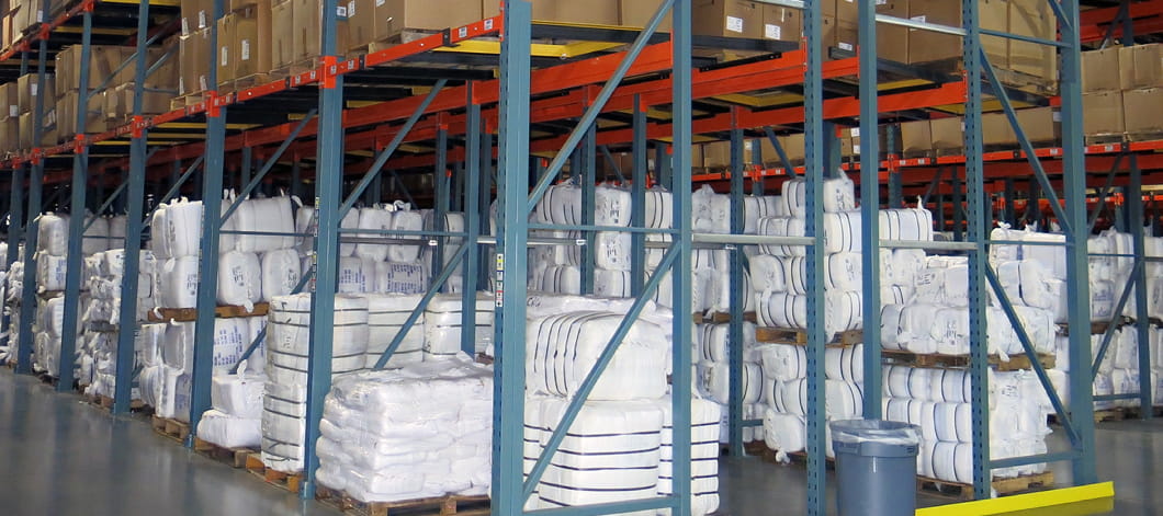 An after view of bales and pallets now stored in a push back pallet rack systems at Standard Textile.