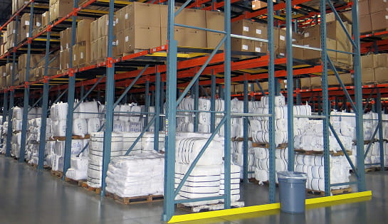 An after view of bales and pallets now stored in a push back pallet rack systems at Standard Textile.