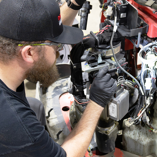 RSC TechLink inspects a forklift engine during a scheduled maintenance visit.