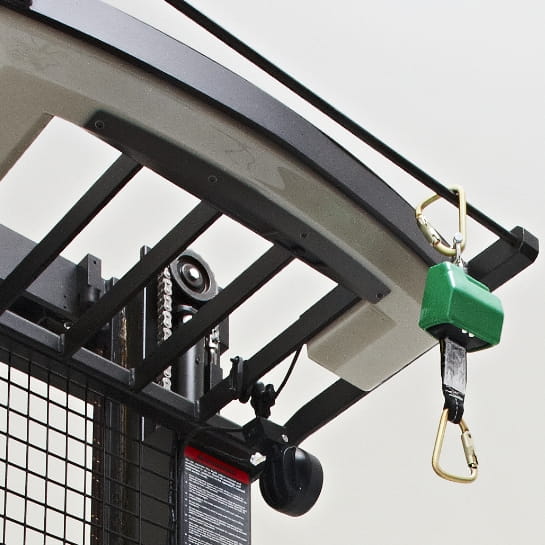 Close up of a safety harness tether hanging from an orderpicker overhead.
